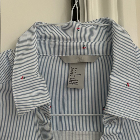 H&M women’s button up shirt, classic blue stripe with small cherry details. - Picture 2 of 4